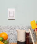 Deako Simple Dimmer switch on a light colored kitchen wall